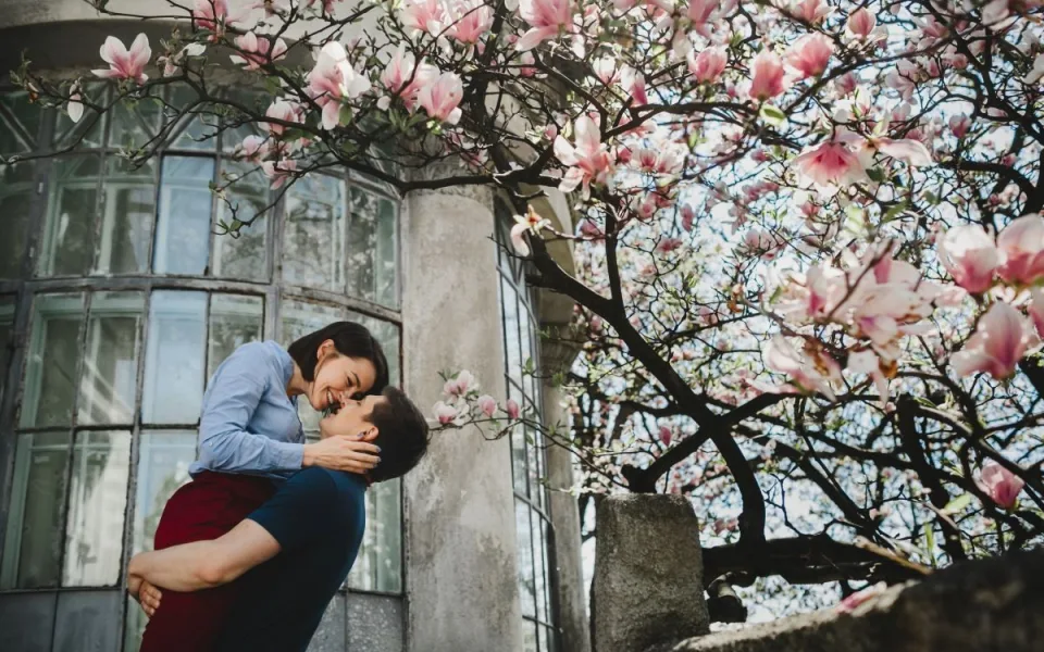 lovely-young-couple-stands-blooming-tree-outside-hug-each-other-tender